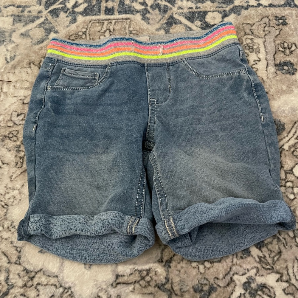 Girls jean shorts with neon waistband size 8.